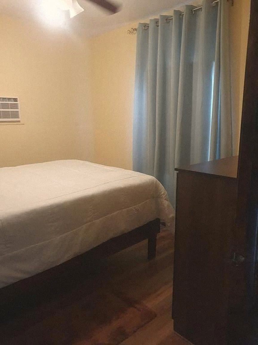 Bedroom with blue curtains