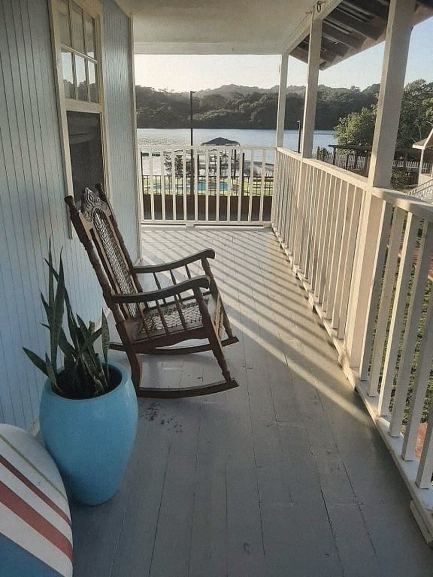 Covered porch with a rocking chair looking out to the bight