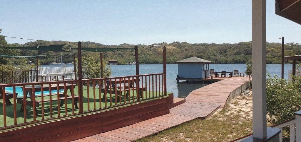 Pool deck and boardwalk leading to the dock and over-water hut